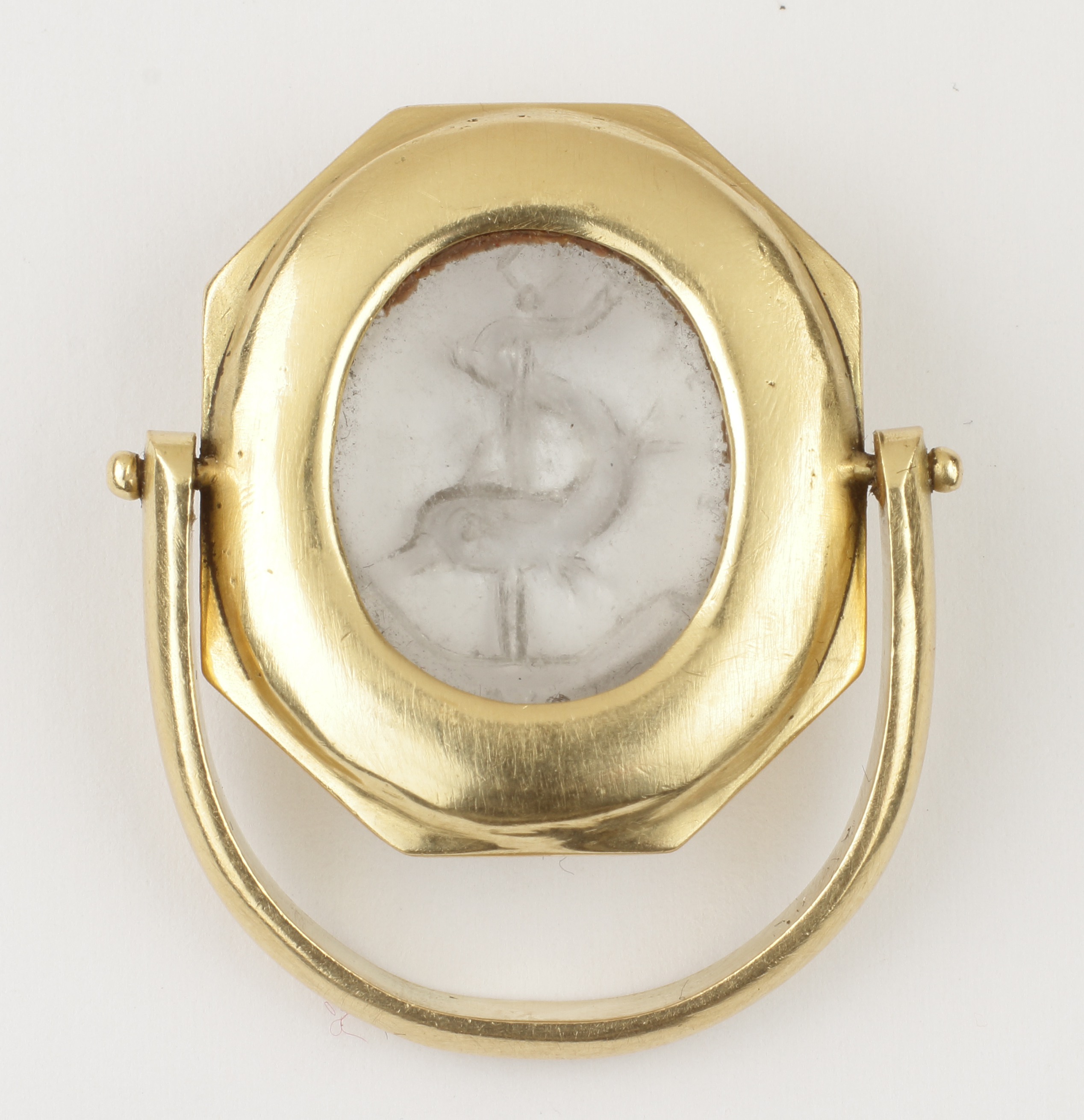 An Early Christian Rock Crystal Intaglio set in a Gold Swivel Ring
